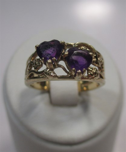 Lot 182 - A 9ct gold lover's ring set with two heart...