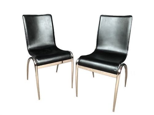 Lot 304 - Actona, Denmark, a set of four black leather and chrome dining chairs