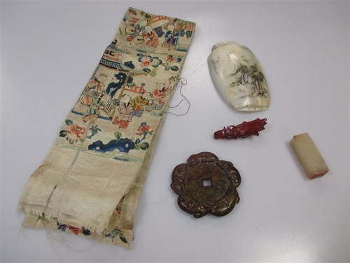 Lot 155 - A box containing a seal, embroidery, mother of...