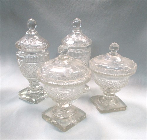 Lot 62 - A pair of cut glass bon-bon jars and  covers