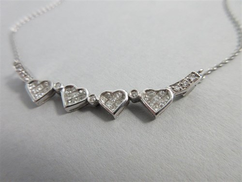 Lot 288 - A diamond set four leaf clover necklace