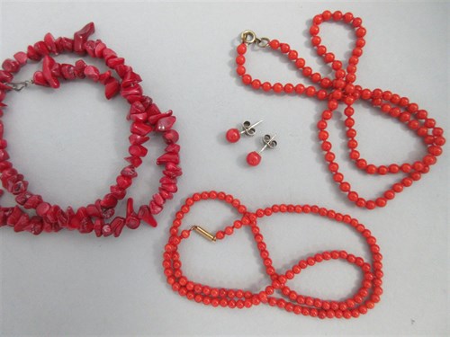 Lot 214 - Three coral bead necklaces and a pair of coral earstuds