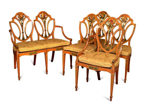 Lot 414 - A suite of Sheraton revival painted satinwood chairs and settee by Wright & Mansfield