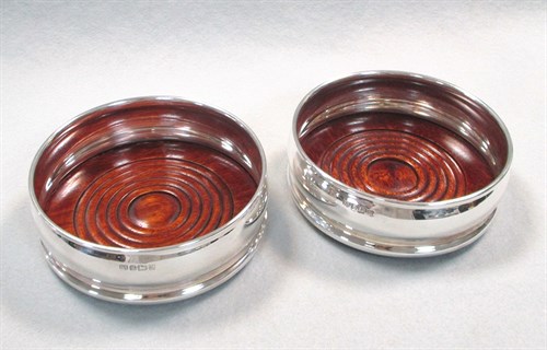 Lot 49 - A pair of 20th century silver bottle coasters