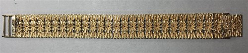 Lot 442 - A flower pattern cuff bracelet
