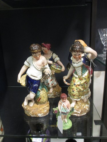 Lot 74 - A set of four porcelain figures representing...
