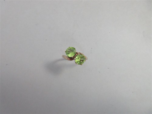 Lot 381 - A peridot two stone ring