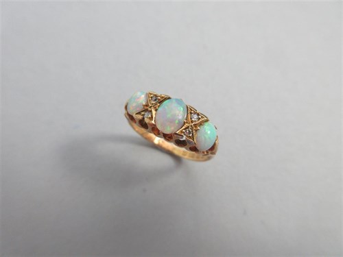 Lot 347 - An Edwardian opal and diamond ring set in 18ct gold