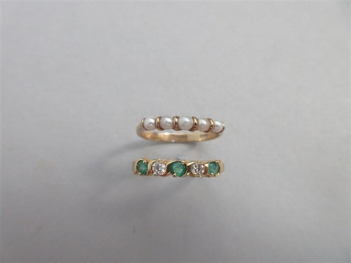 Lot 364 - An emerald and diamond five stone ring together with a similar pearl ring