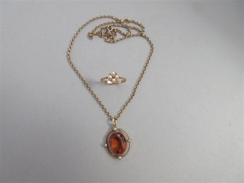 Lot 189 - A citrine and seed pearl pendant on gold chain together with a pearl and gold ring
