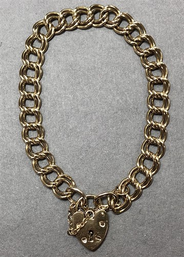Lot 132 - A 9ct double curb link charm bracelet, with...