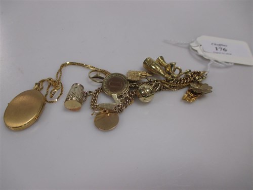 Lot 176 - A 9ct locket and chain 6.6g and a German charm...