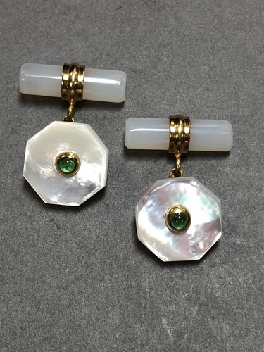 Lot 354 - A pair of mother of pearl and emerald set cufflinks