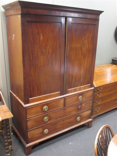 Lot 379 - A George III mahogany linen press with slides,...