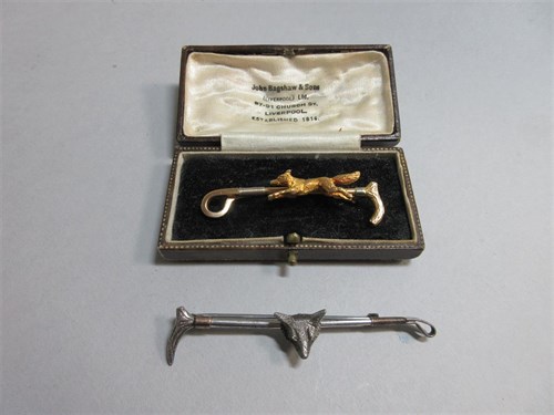 Lot 232 - Two fox and whip stock pins