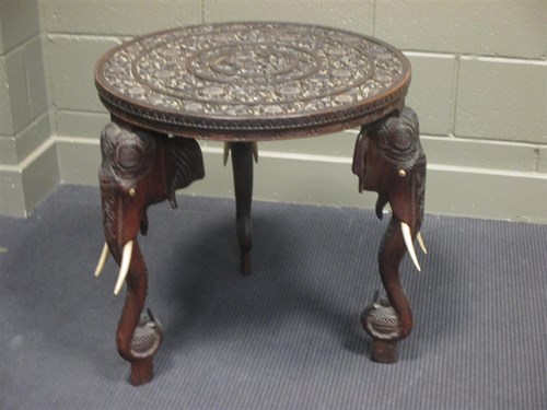 Lot 359 - An Anglo Indian carved occasional table on...