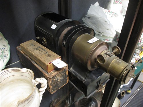 Lot 103 - A magic lantern projector (lacking lamp) and...