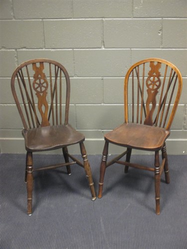 Lot 384 - A set of nine ash and elm wheel back chairs