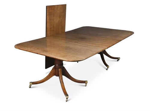 Lot 413 - A George III plum pudding mahogany twin pedestal dining table