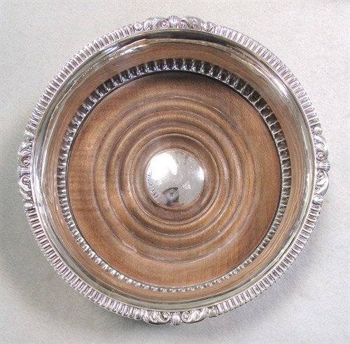 Lot 97 - A pair of George III silver wine coasters