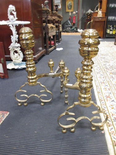 Lot 334 - Pair of brass firedogs, in 17th century style
