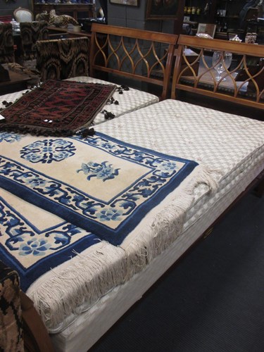 Lot 399 - A pair of tulip wood framed single beds by...