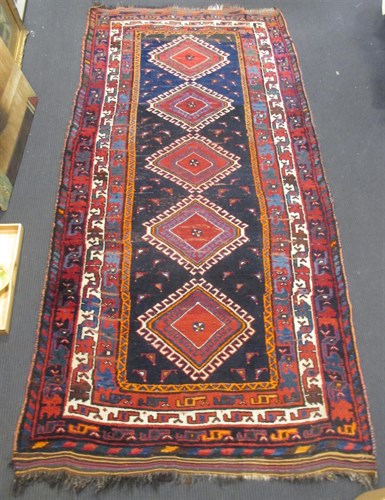 Lot 455 - A blue ground Kazak rug 284 x 132cm