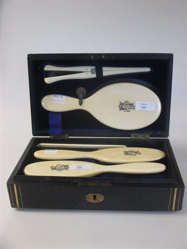 Lot 149 - A cased set of Victorian ivory backed hairbrushes