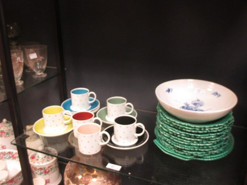 Lot 95 - A set of six Susie Cooper coffee cans and...