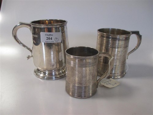 Lot 204 - Three silver christening mugs, Sheffield 1915,...