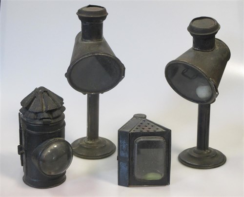 Lot 14 - A pair of candle lamps, a hand-held miner's...