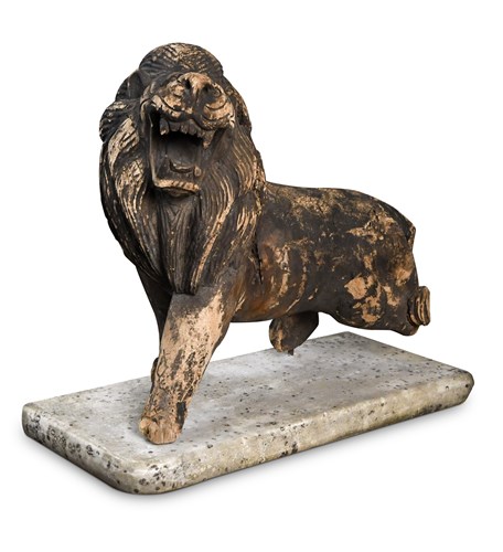Lot 259 - An Eastern carved wood figure of a Lion, on a...