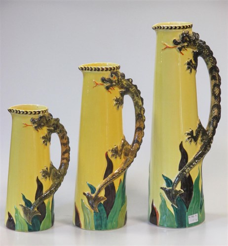 Lot 126 - A set of three graduated jugs by Bishop with...