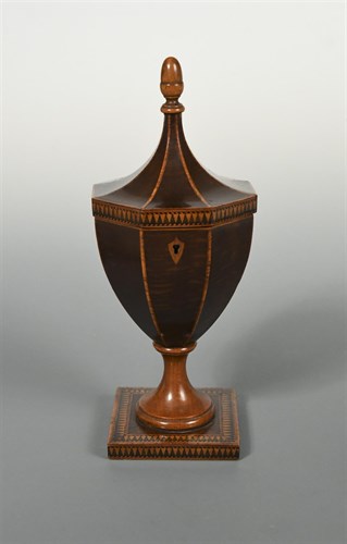 Lot 293 - A sycamore pedestal urn-shaped tea caddy