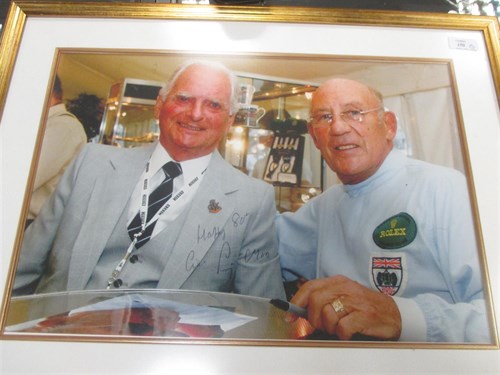 Lot 150 - A signed photograph of Sterling Moss; A Graham...