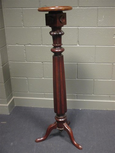 Lot 420 - A mahogany tripod torchere 139cm high