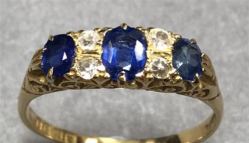 Lot 265 - An Edwardian sapphire and diamond seven stone ring set in 18ct gold