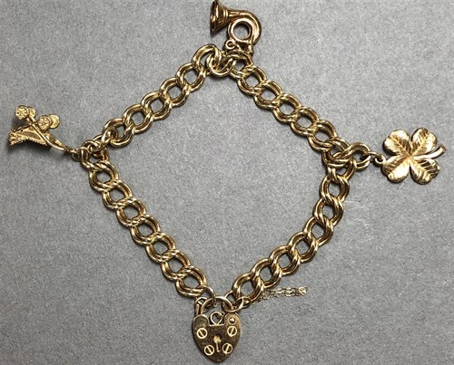 Lot 181 - A 9ct gold double curb link charm bracelet...
