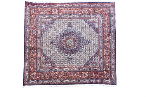 Lot 440 - A Tabriz carpet, with cream field and central...