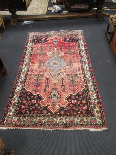 Lot 461 - A faded Bokhara rug, a floral pattern Persian...