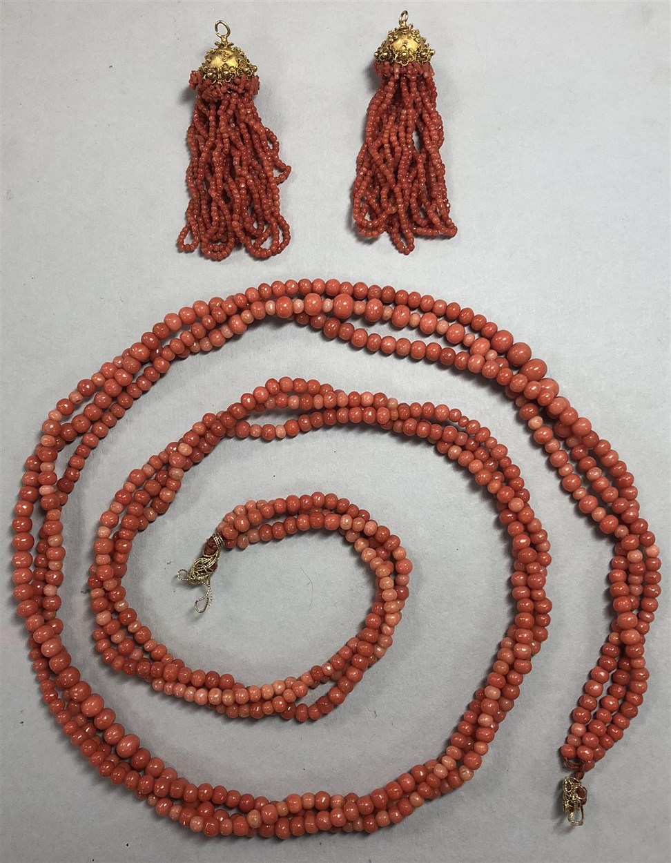 Lot 207 - A three row coral necklace and matched chandelier tassels