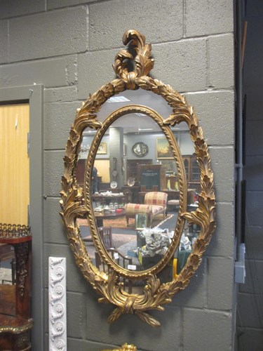 Lot 326 - A pair of 18th Century-style oval giltwood...