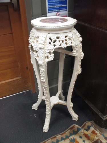 Lot 414 - A painted carved wood and marble top urn stand...