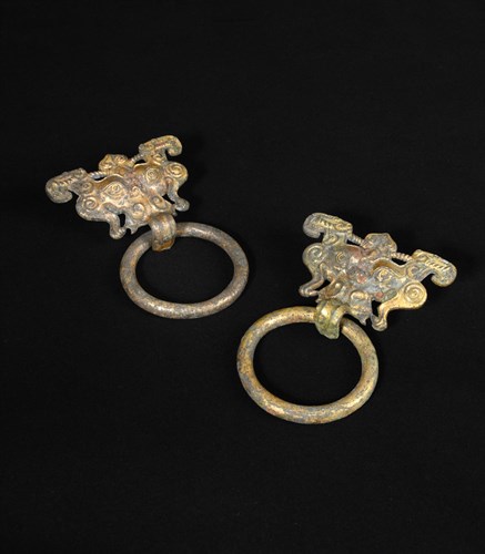 Lot 4 - A pair of gilt-bronze Taotie masks fitted with loose ring handles, Han dynasty (206BC - AD220)