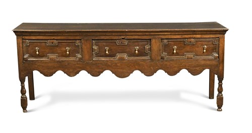 Lot 384 - A late 17th century oak dresser base, with...