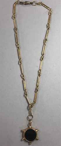Lot 227 - A fancy link watch chain supporting a ship's wheel fob