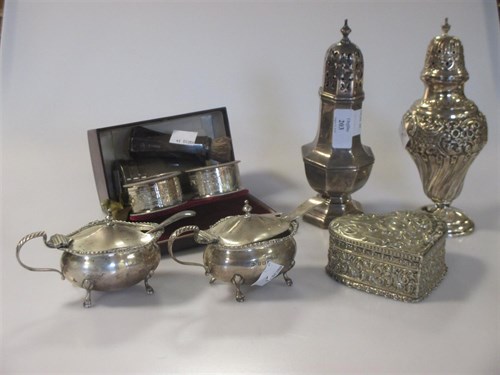 Lot 203 - Two silver sugar casters, a pair of silver...