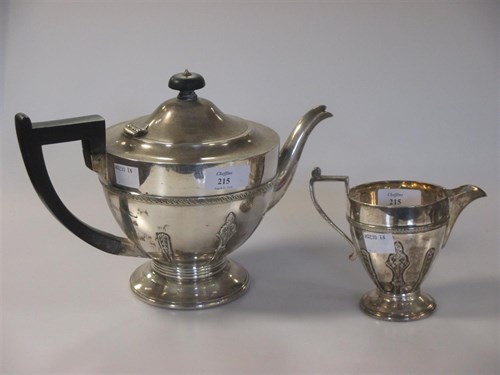 Lot 215 - A 20th century silver teapot & cream jug, 31oz