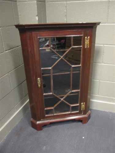 Lot 378 - A George III mahogany glazed corner cupboard,...