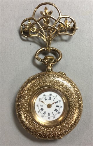 Lot 153 - An unsigned continental lady's open faced fob watch